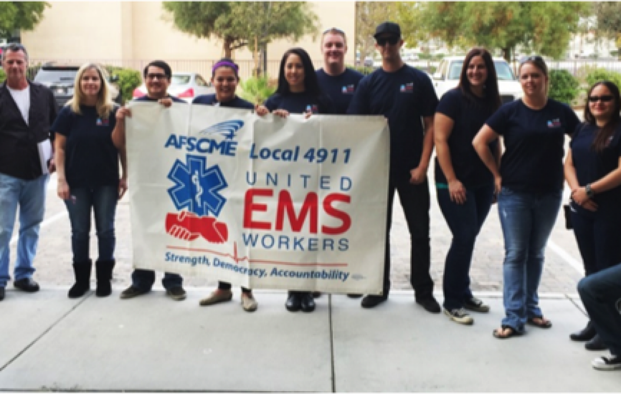 Members of United EMS Workers-AFSCME Local 4911 gather before delivering petition to AMR demanding respect. Photo Credit: Ashley Mates