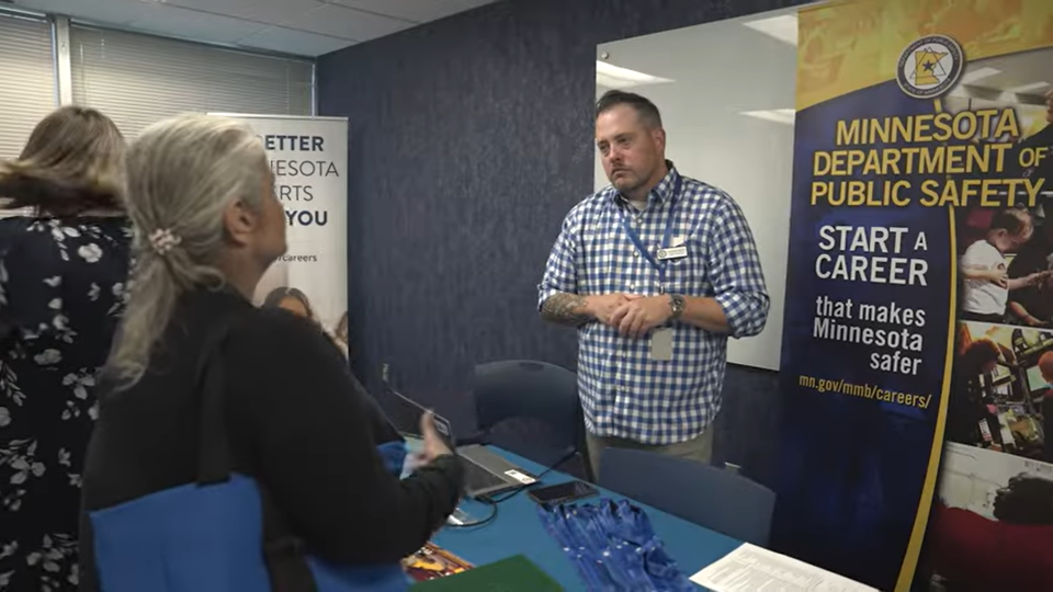 Recruiter talks to someone about careers in public safety.