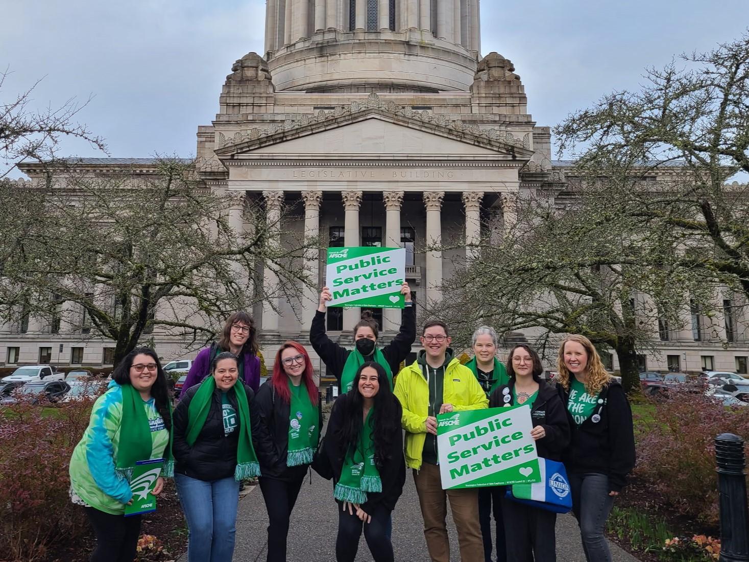 Member lobbyists standing in front of the Washington State Capitol Building