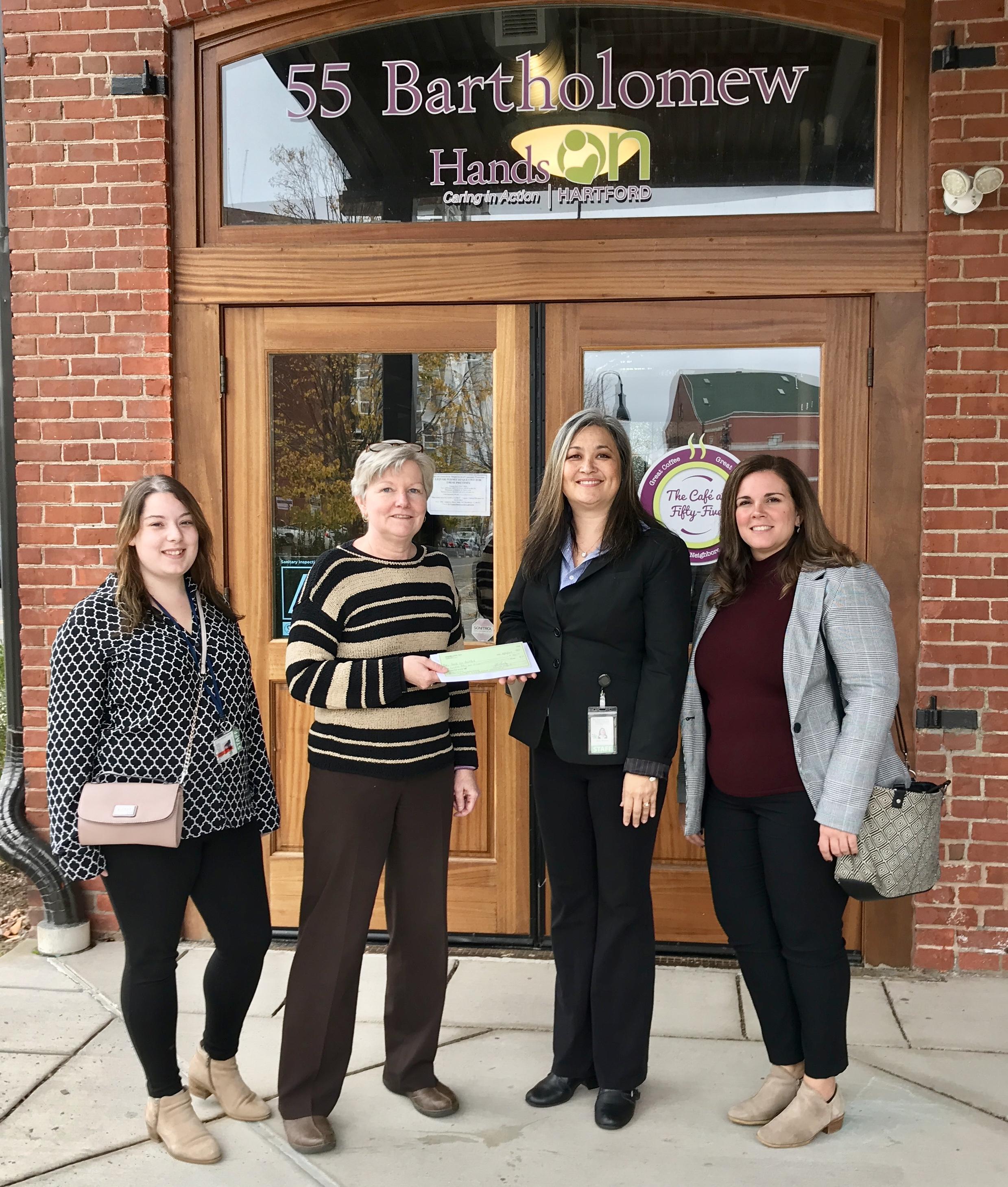 L-R: Local 1214 Giving Committee members Laura Duquette, Kate Griffin and Local President Wanda Warshauer present the union's donation to Hands On Hartford's Kate Shafer.