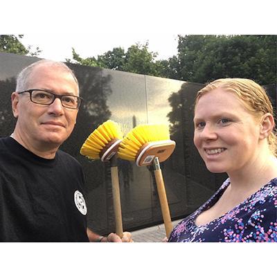 Gerry Fidler and his wife Melissa washing the Vietnam Veterans Memorial.