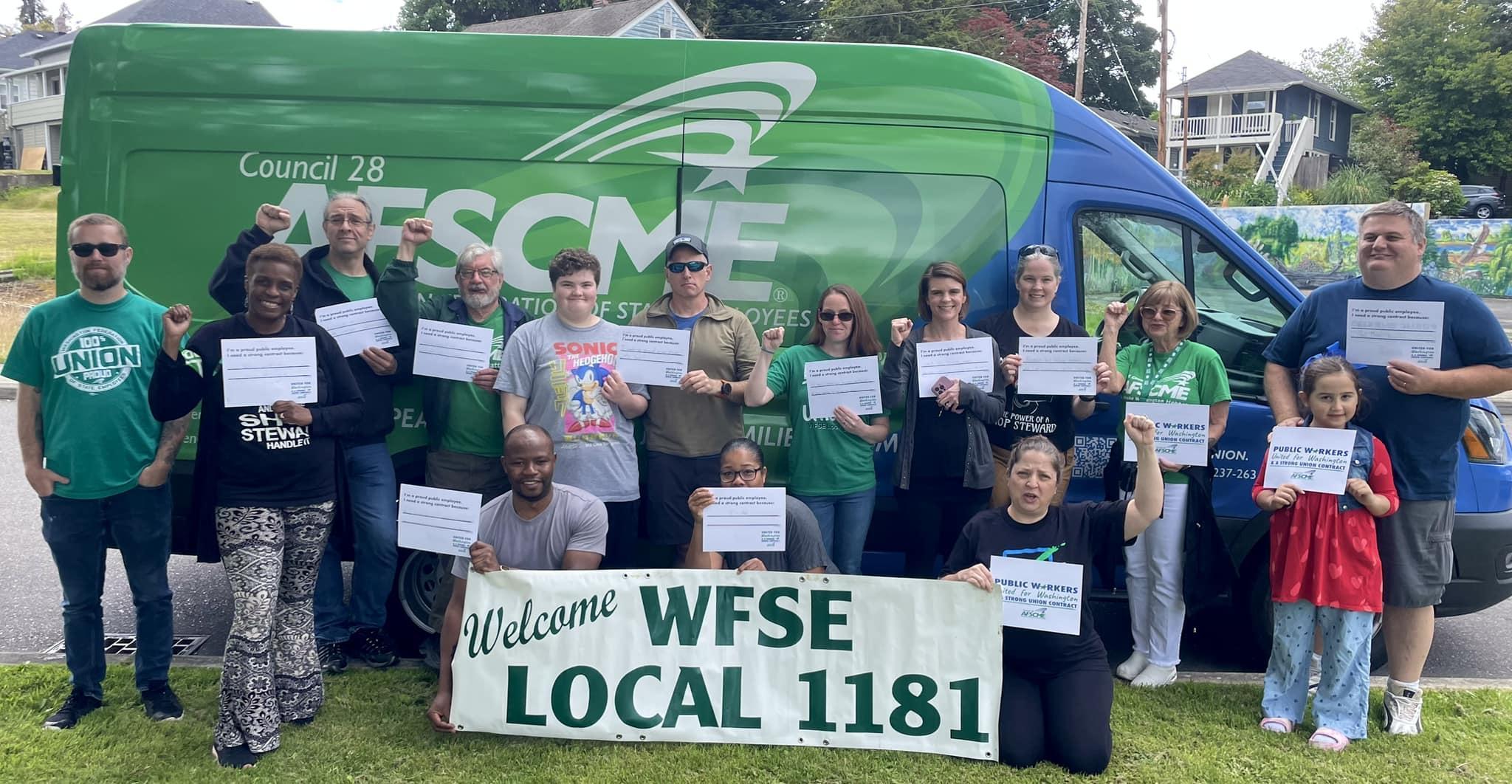 A picture of WFSE Local 1181 members in front of WFSE's "Green Machine" van.